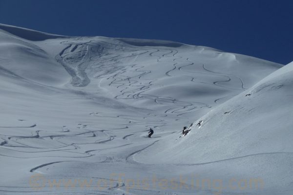 Erick in action - sluff-alanche from Jess' skier cut on the roll at the top.